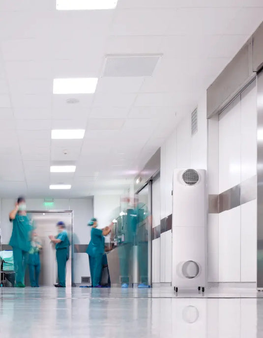 Busy hospital hallway with an INOVA commercial air purifier.