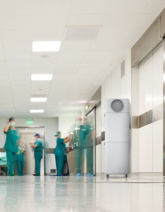 hospital hallway showing stretcher and INOVA commercial air purifier