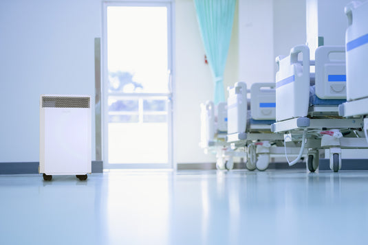 hospital room with beds and an INOVA air purifier