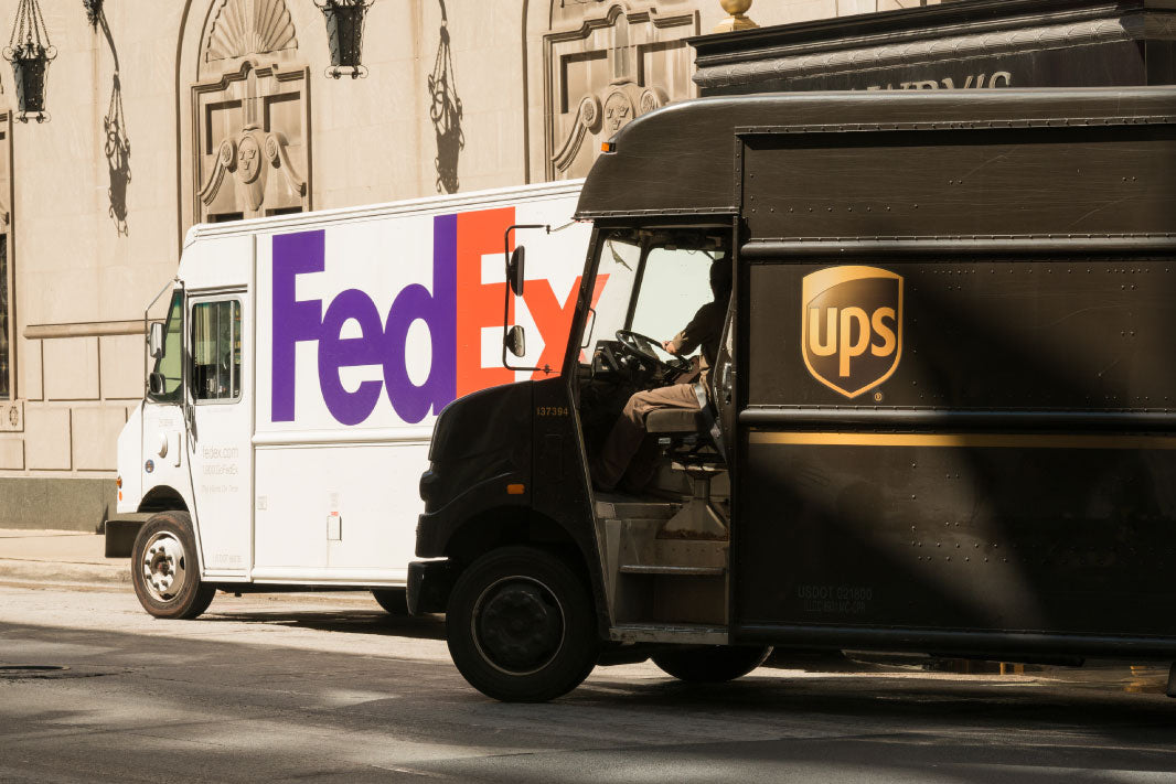 ups and fedex truck shipping