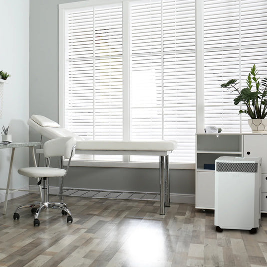 A modern treatment room at a doctor's surgery. An INOVA air purifier sits on the floor, quietly cleaning the air, removing viruses, bacteria and allergens.